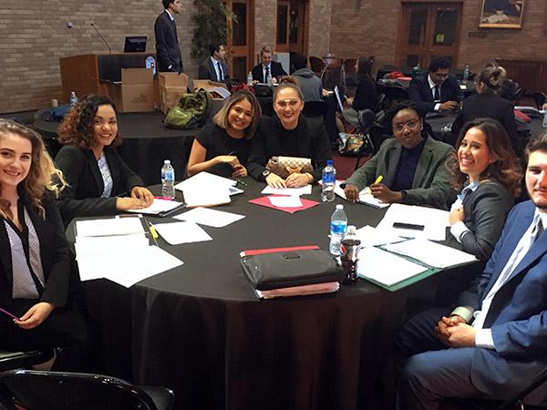 Students sitting at a table preparing for a competitive event